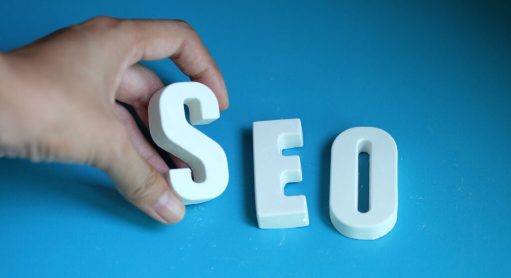hand arrange white letters as seo